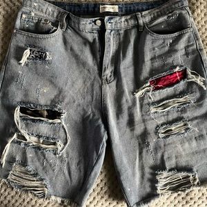 Mens ripped denim shorts.